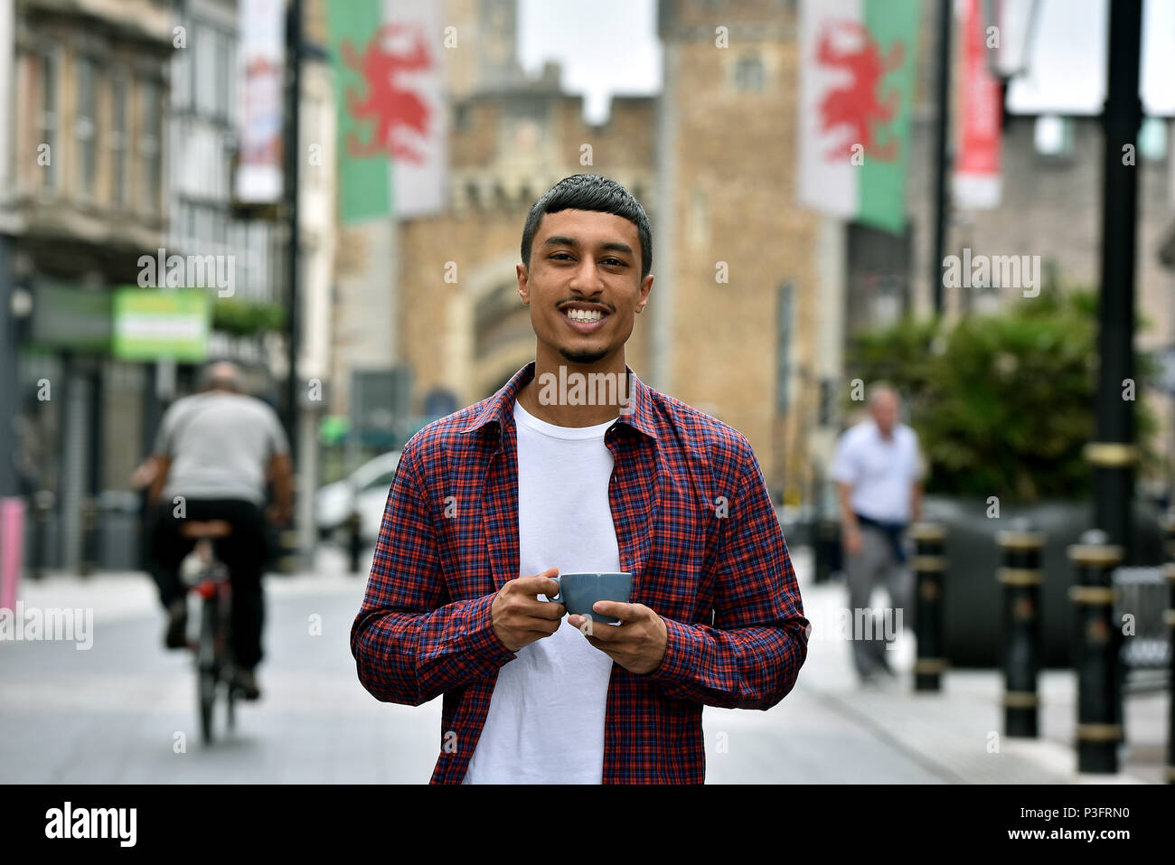 Pictures show Ibby Tarafdar, aged 27 years of Gabalfa, Cardiff. Ibby a graphic designer has been commissioned by Jay Z , but still works at Starbucks Stock Photo