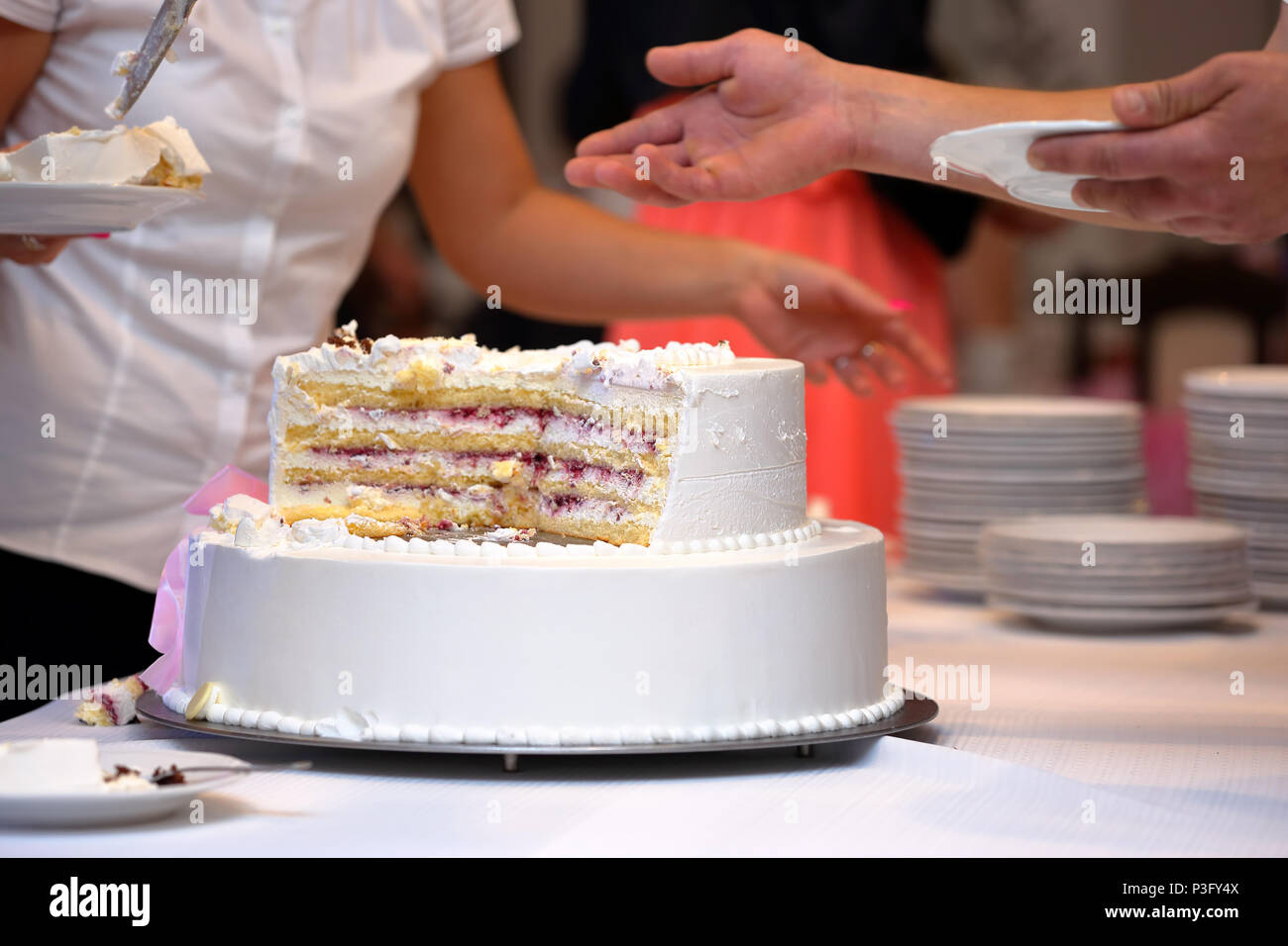 White wedding cake with strawberry on wedding party Stock Photo