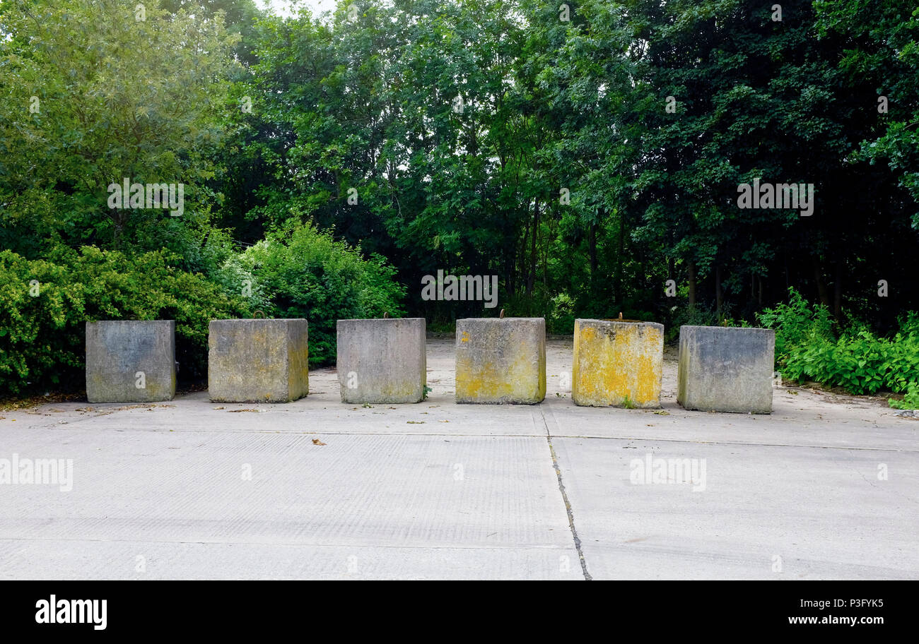 Concrete blocks to prevent parking or camping UK Stock Photo