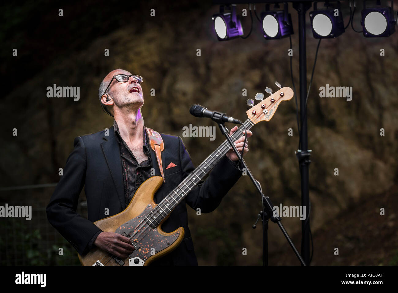 Yan Speake bassist with The Grace Notes performing at Trebah Garden amphitheatre in Cornwall. Stock Photo