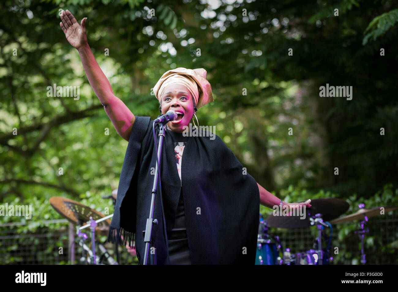 Ley Adewole lead singer with the The Grace Notes performing at Trebah Garden amphitheatre in Cornwall. Stock Photo