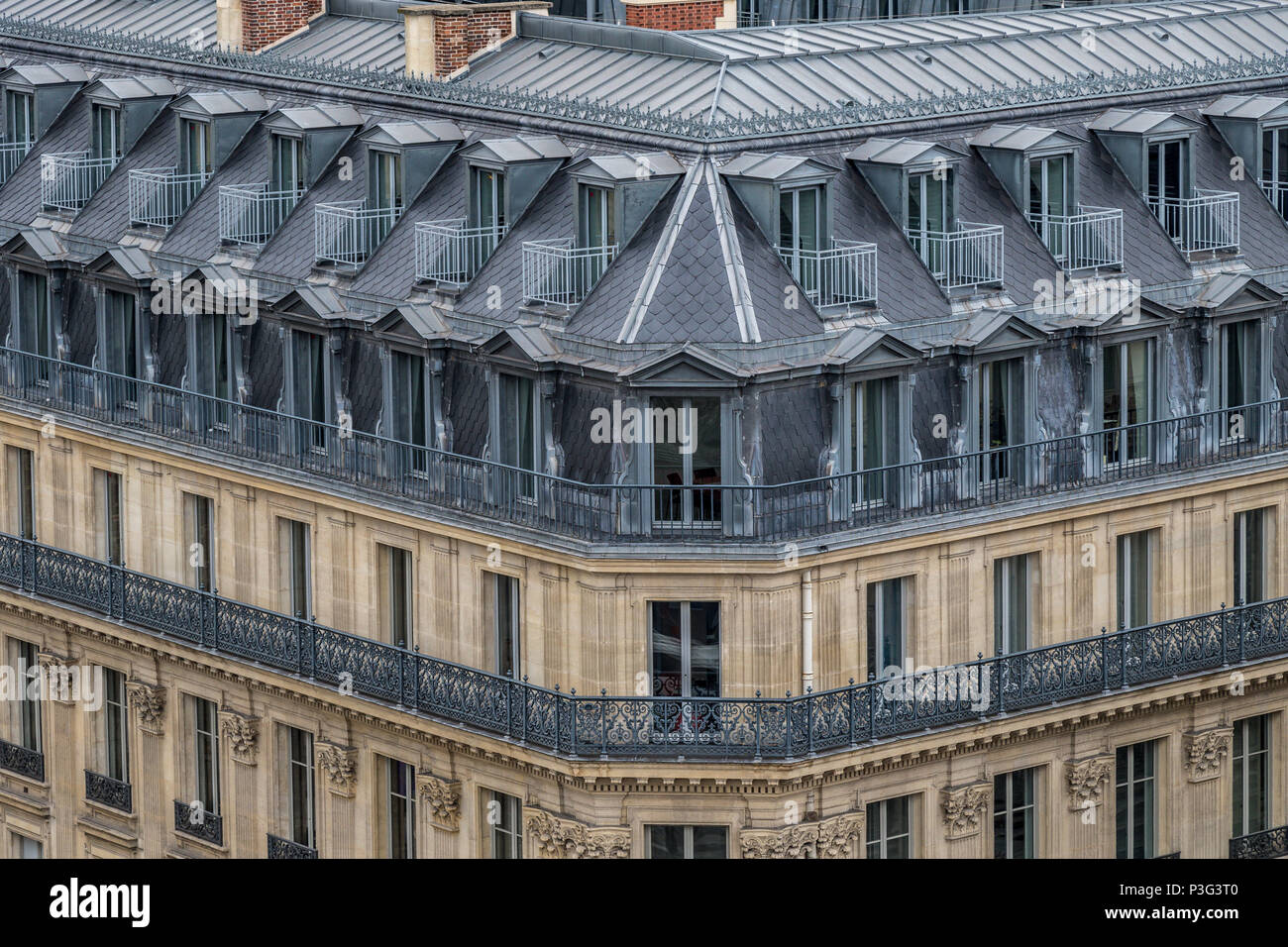 The elegant grey slate rooftops of Paris apartment buildings a running