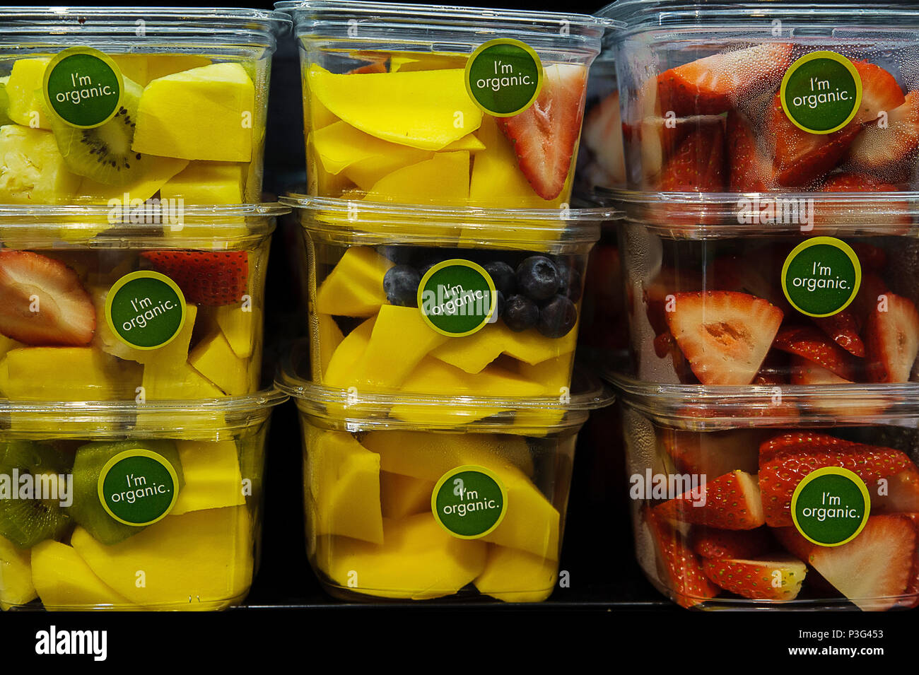 Organic labeled fruit packed for convenience in plastic container Stock Photo