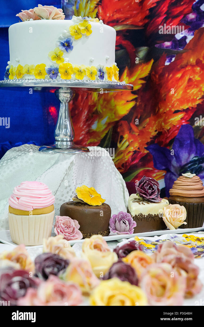 Wedding Cake And Cupcakes Decorated With Edible Crystallized