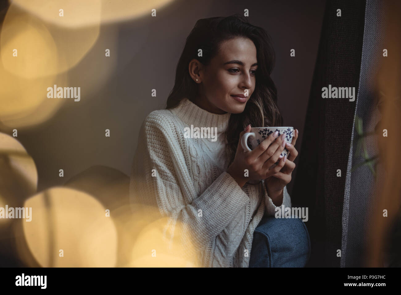 Beautiful woman holding a coffee cup Stock Photo