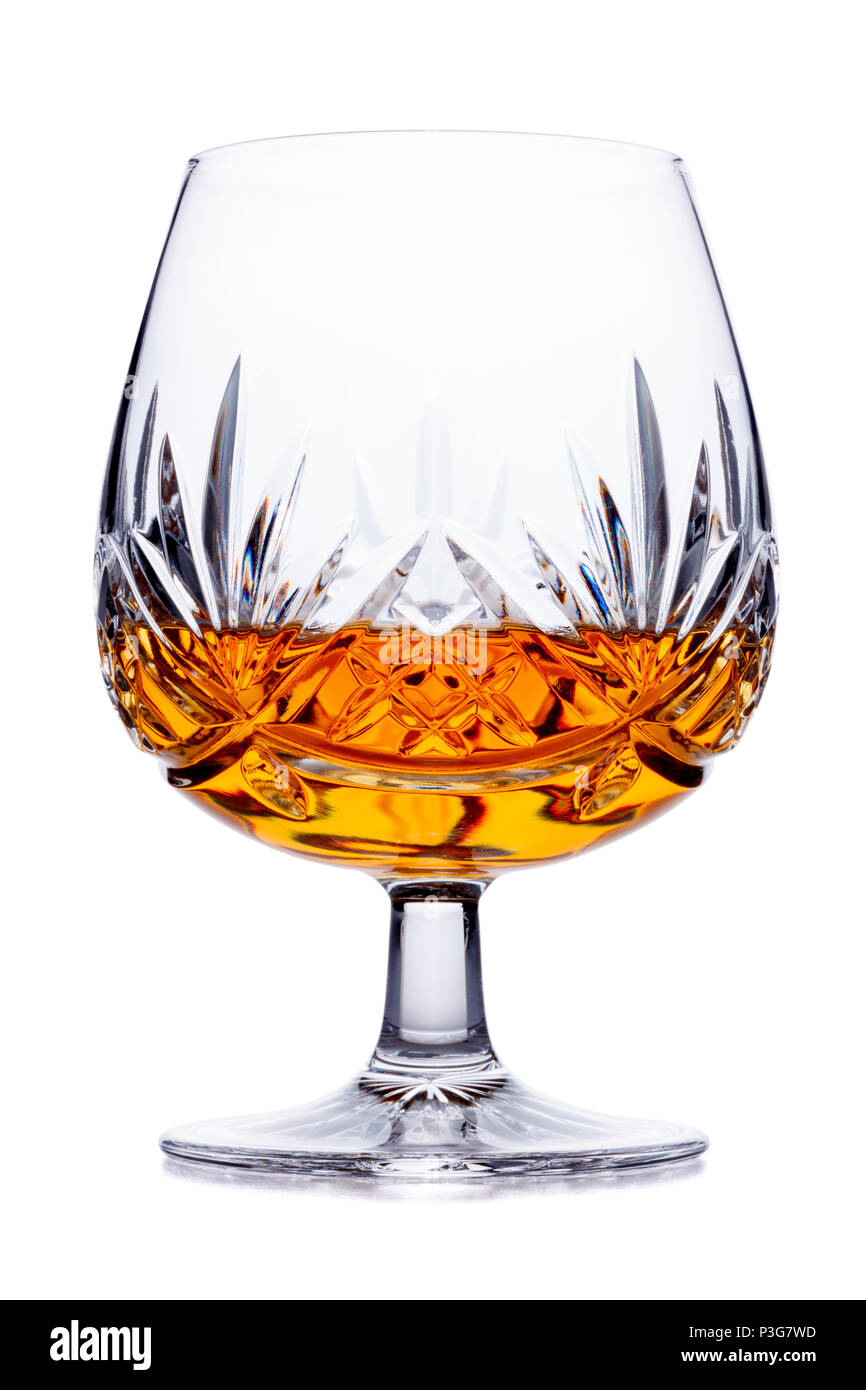 A single crystal brandy glass, shot on white, with a small reflection