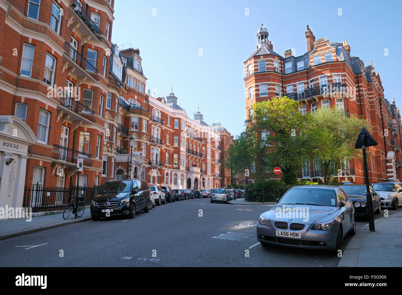 Elegant red brick mansion blocks in Kensington Court, Royal Borough of Kensington and Chelsea, London W8, England, UK Stock Photo