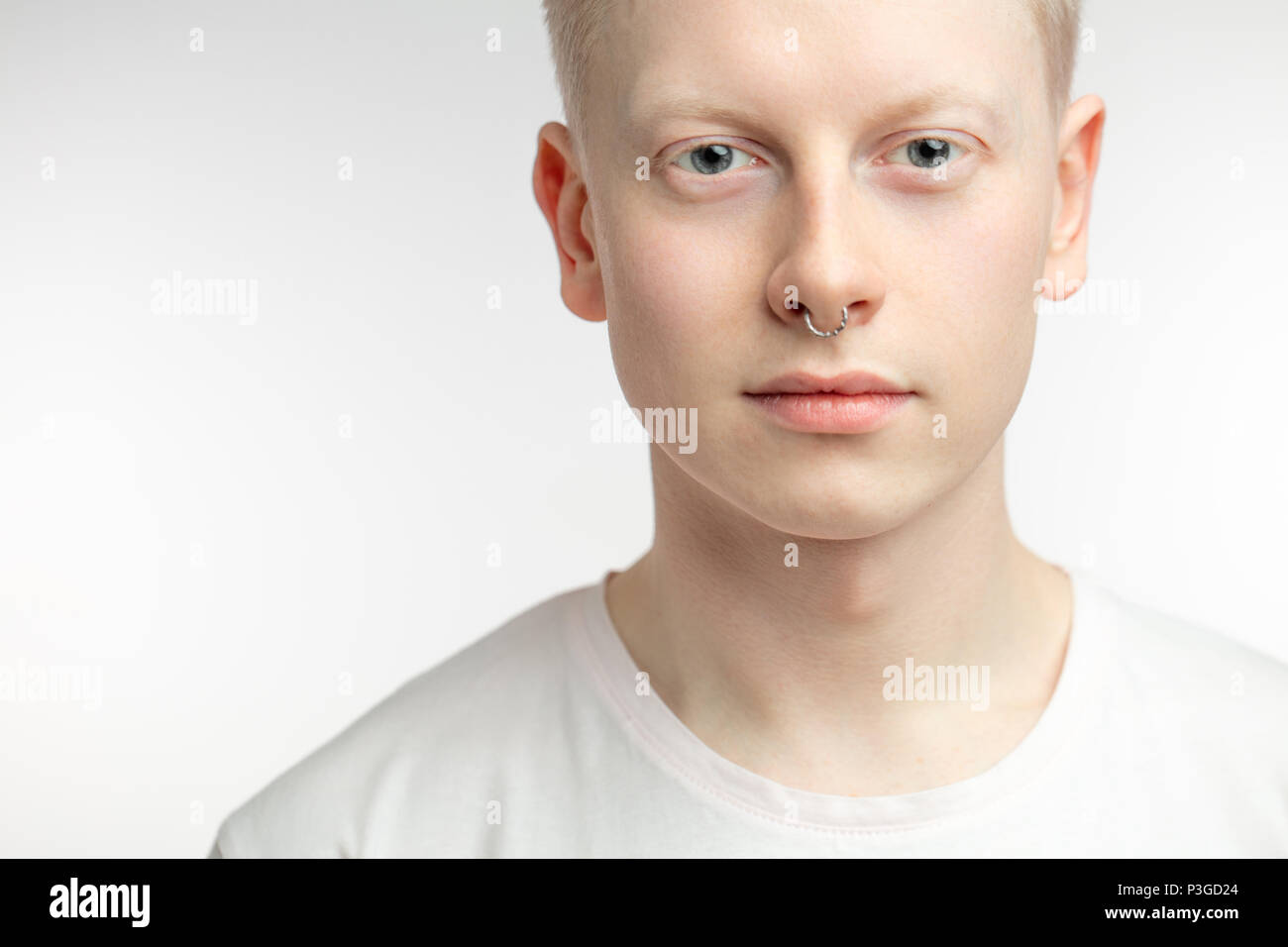 Handsome young man blond hair and blue eyes hi-res stock photography ...
