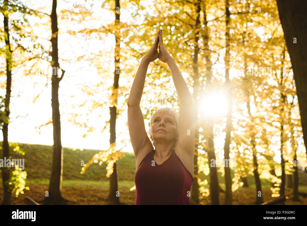 Yoga woman standing senior hi-res stock photography and images - Alamy