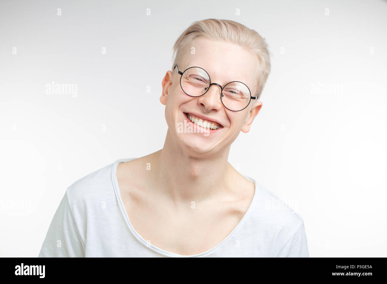 Portrait of a handsome young man, over a gray background Stock Photo ...