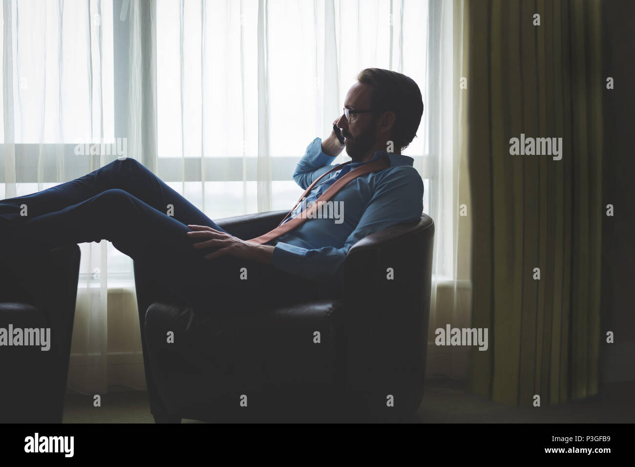 Businessman using mobile phone Stock Photo