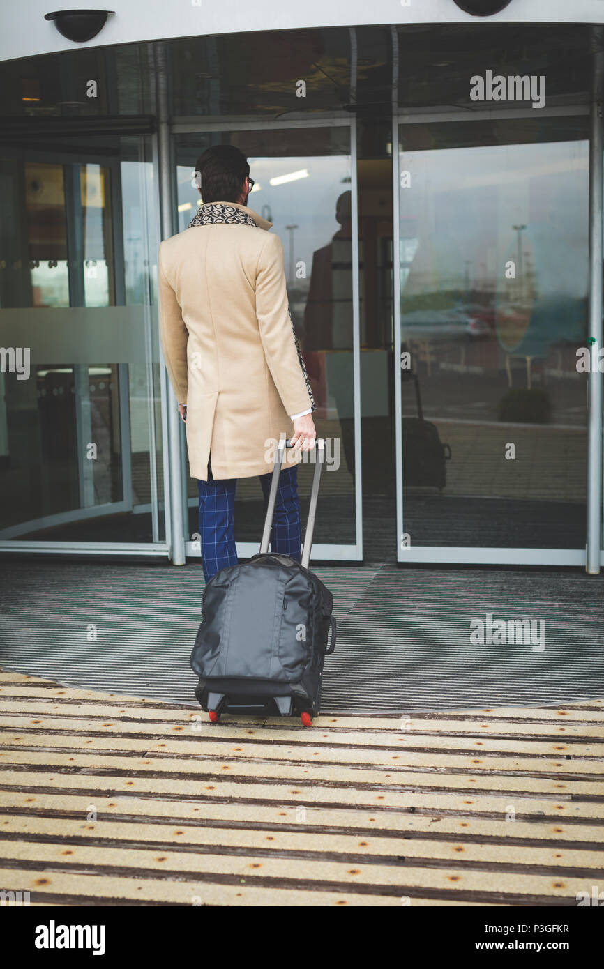 Businessman arriving at hotel Stock Photo