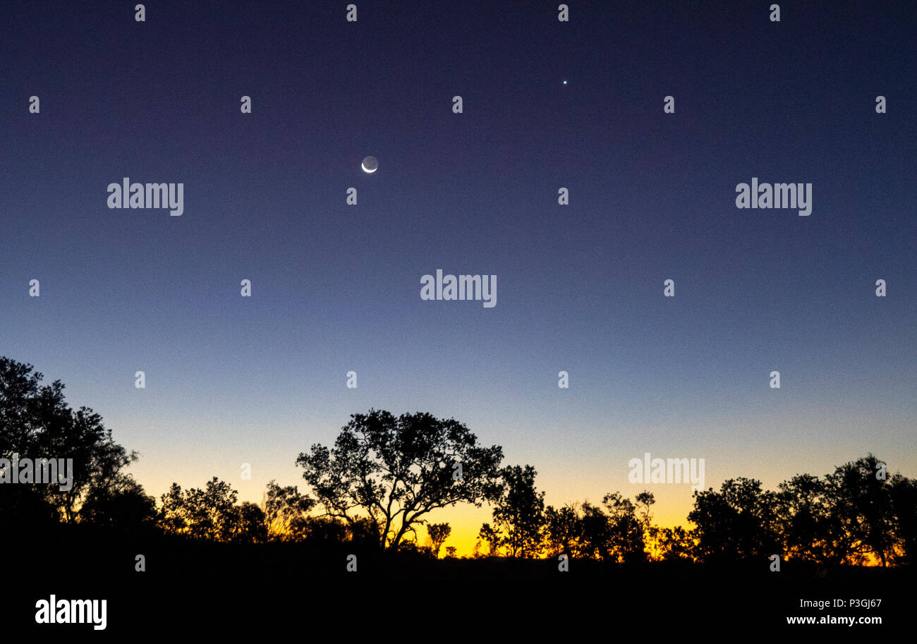 Sunset early evening with the crescent of the moon and the planet Venus in the sky Kimberley WA Australia. Stock Photo
