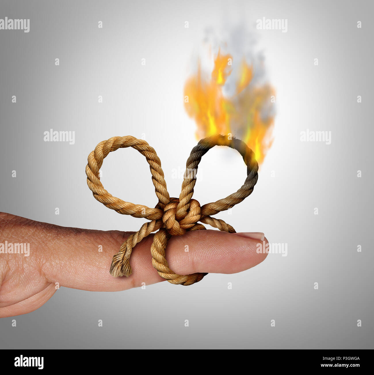 Losing memories as a burning remember knot and reminder symbol as a string tied on a finger forgetting a future planned event. Stock Photo