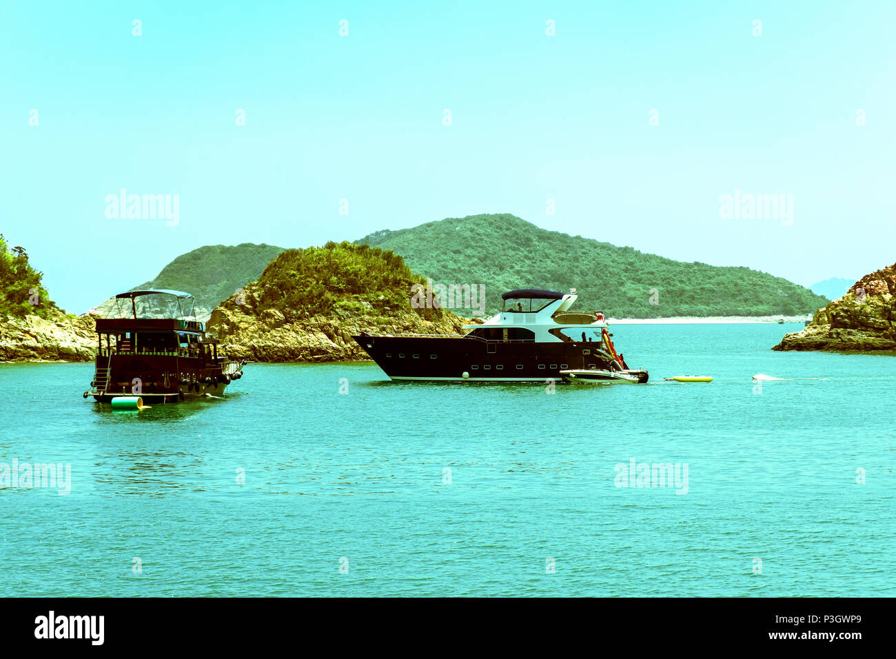 Recreational boats anchoring near small islands. A group of