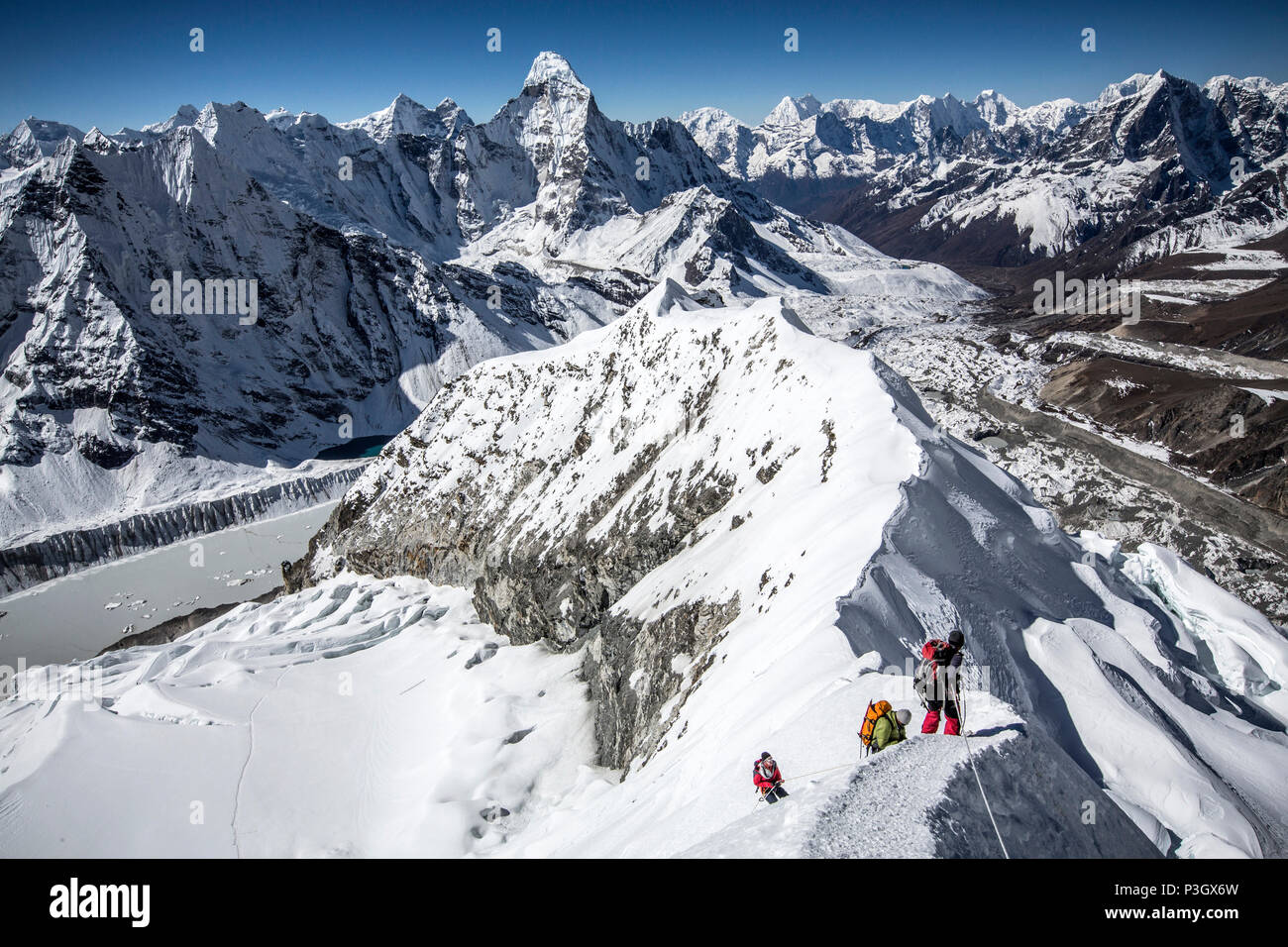 Mountain climbers descending from Island Peak, Khumbu Valley, Nepal Stock Photo