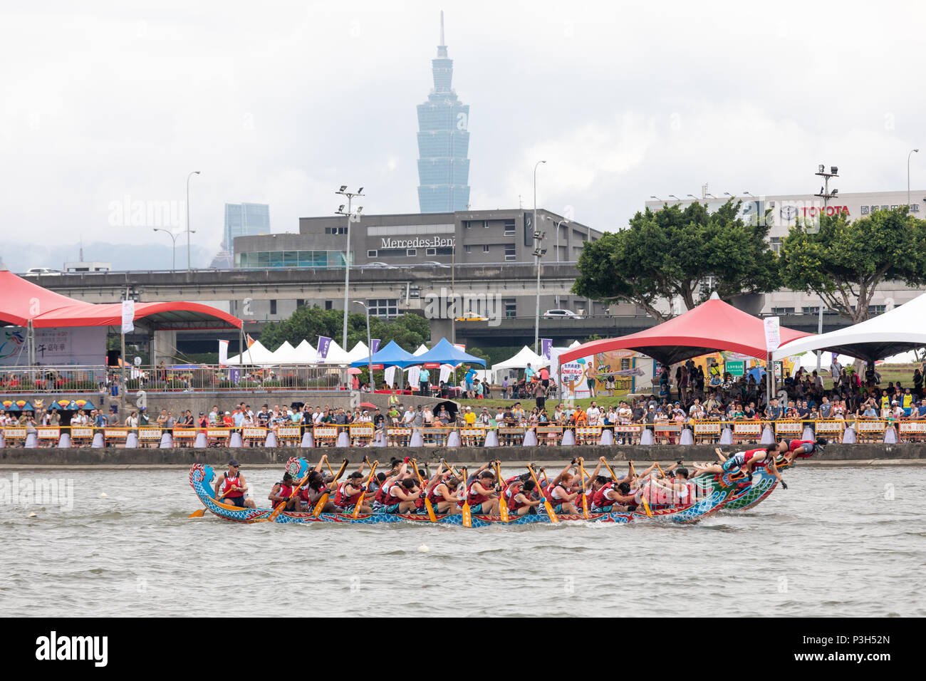 Taipei, Taiwan, 18 June Dragon boats pass below Taipei 101 during the