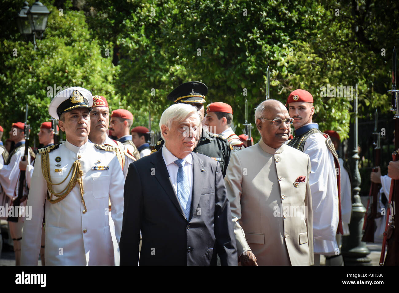 (L) Greek President Prokopis Pavlopoulos and  and his Indian counterpart Ram Nath Kovind (R) inspects the presidential evzones guards during an official welcome ceremony in Athens.  Ram Nath Kovind starts a two-day visit to Greece. Stock Photo