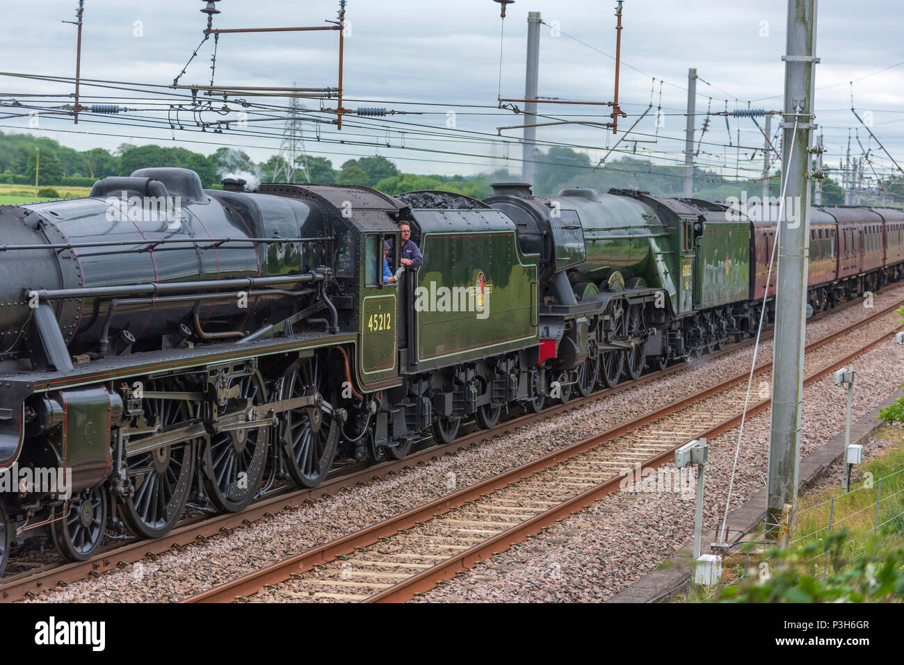 Winwick Cheshire United Kingdom.  18th June 2018. The world’s most famous steam locomotive, LNER A3 Class 4-6-2 no 60103 Flying Scotsman seen crossing Winwick Junction on the West Coast Main Line behind Stanier Black Five  LMS Class 5MT 4-6-0 no 45212 loco hauling day 1 of Steam Dreams railtour The Lakes Express. Credit: John Davidson Photos/Alamy Live News Stock Photo