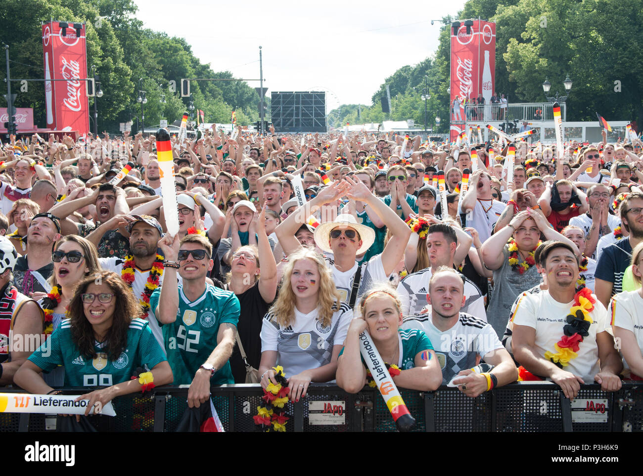 Feature fans in the front row at the Brandenburger goal look at