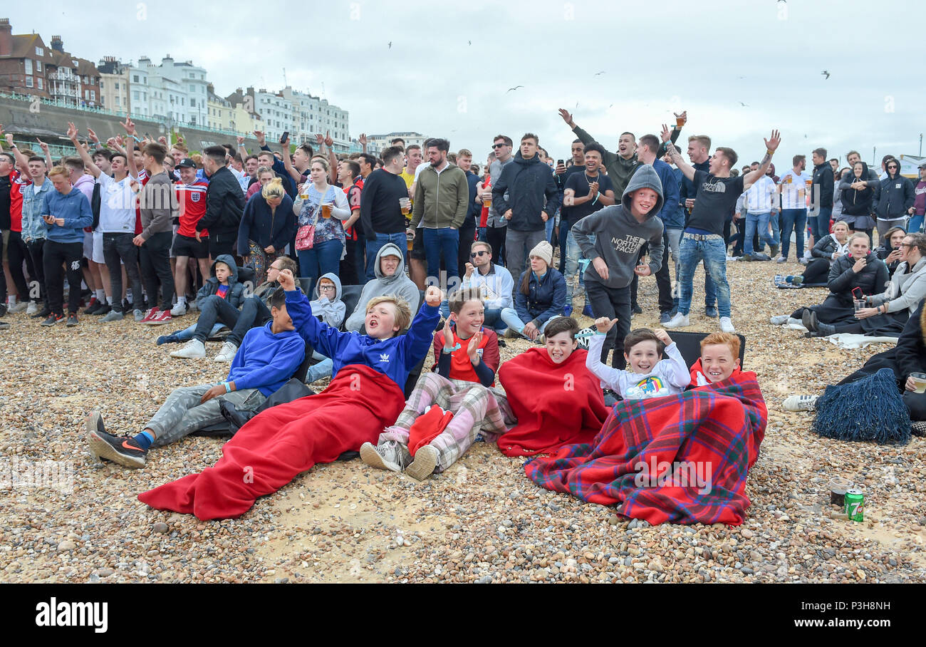 Brighton, UK. 18th June, 2018. England football fans watch the match on a giant screen on Brighton seafront as they play against Tunisia in the World Cup in Russia Credit: Simon Dack/Alamy Live News Stock Photo