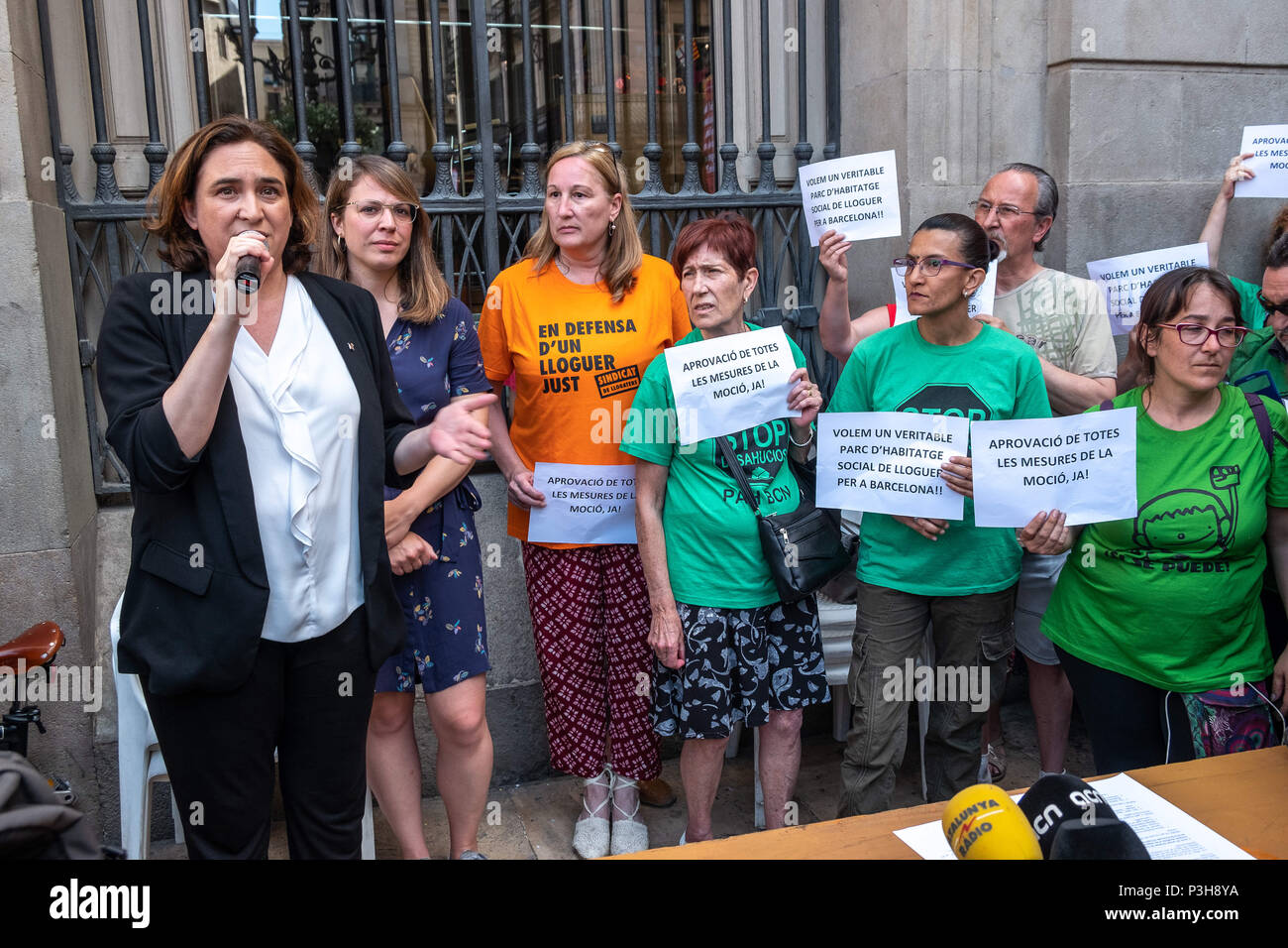 June 18, 2018 - Barcelona, Catalonia, Spain - The mayor Ada Colau and the director of the area of urbanism, Janet Sanz, are seen accompanying the social entities during the signing of the agreement. Thanks to the impulse of the groups that defend the right to housing, the proposal to force the real estate developers to allocate 30% of the promotion to social rent housing is going forward. The mayor Ada Colau and various entities for public housing have staged outside Barcelona City Council the signing of the agreement that now must go through different institutional procedures to be finally ap Stock Photo