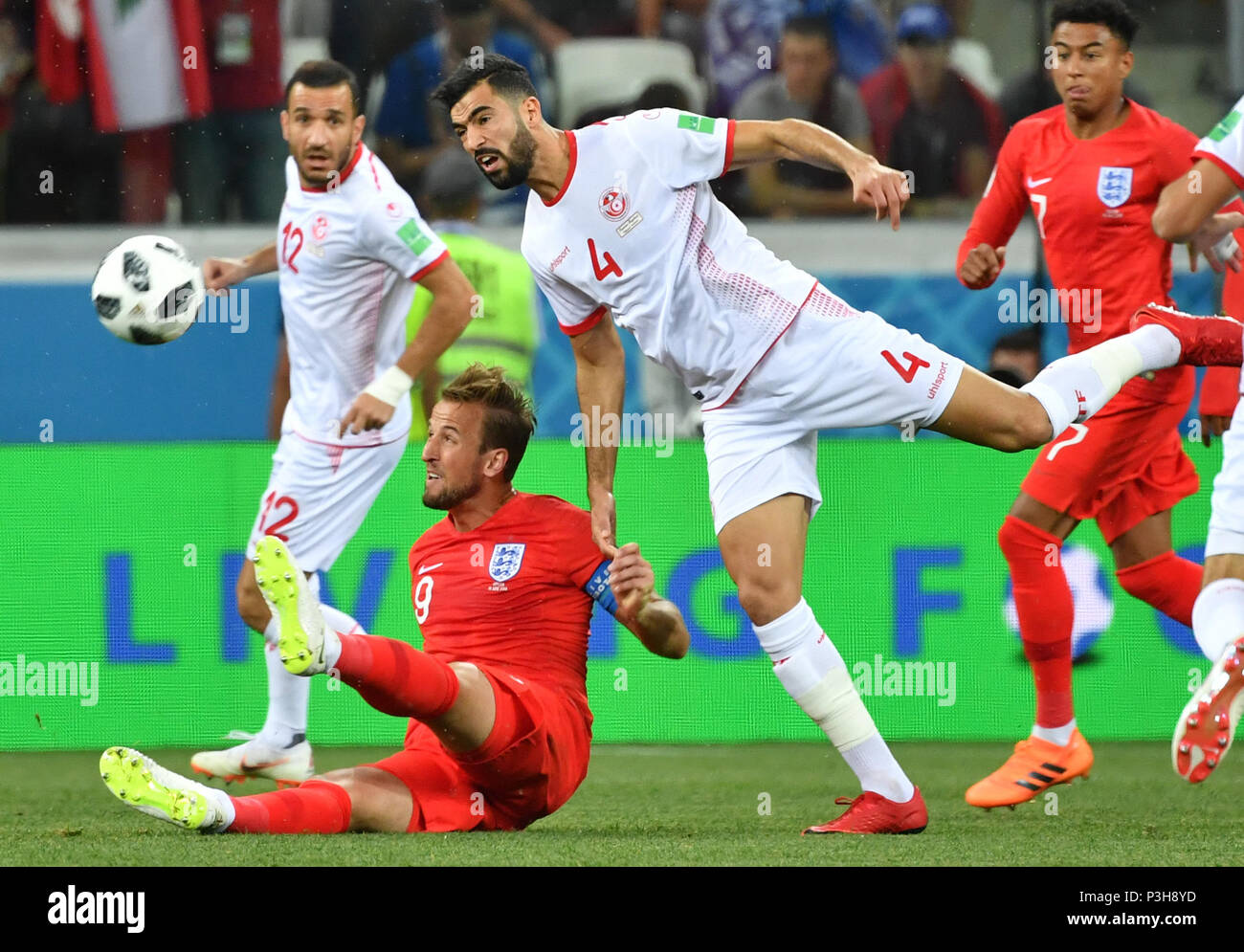Volgograd, Russia. 18th June, 2018. Harry Kane?2nd L?of England vies with Yassine Meriah (2nd R) of Tunisia during a group G match between Tunisia and England at the 2018 FIFA World Cup in Volgograd, Russia, June 18, 2018. Credit: Liu Dawei/Xinhua/Alamy Live News Stock Photo