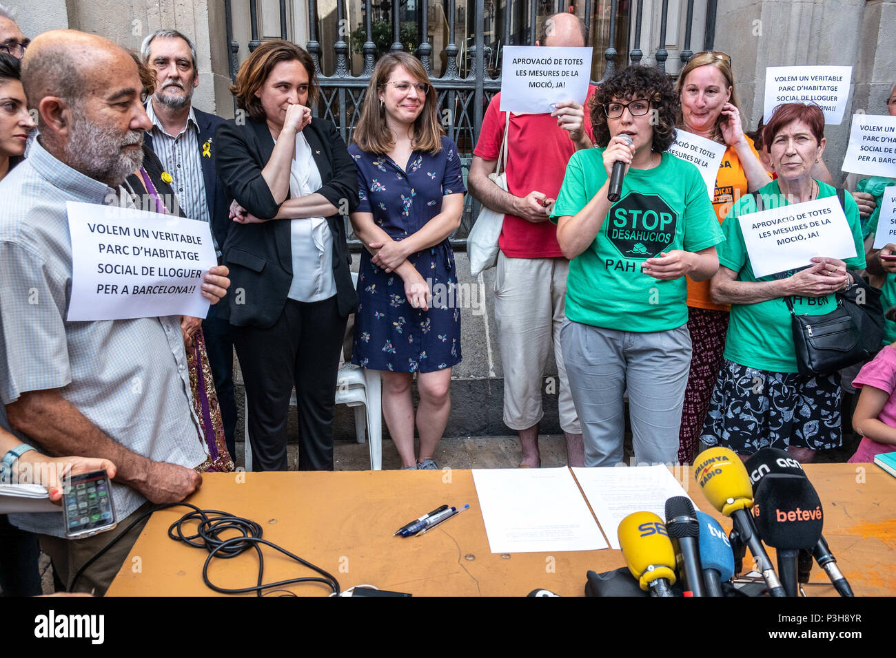 June 18, 2018 - Barcelona, Catalonia, Spain - The mayor Ada Colau and the director of the area of urbanism, Janet Sanz, are seen accompanying the social entities during the signing of the agreement. Thanks to the impulse of the groups that defend the right to housing, the proposal to force the real estate developers to allocate 30% of the promotion to social rent housing is going forward. The mayor Ada Colau and various entities for public housing have staged outside Barcelona City Council the signing of the agreement that now must go through different institutional procedures to be finally ap Stock Photo