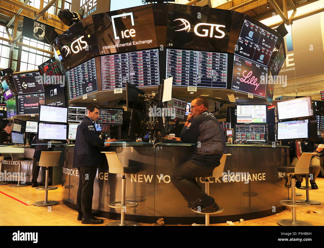 New York, USA. 18th June, 2018. Traders work at the New York Stock Exchange in New York, the United States, on June 18, 2018. U.S. stocks ended mixed on Monday. The Dow Jones Industrial Average was down 103.01 points, or 0.41 percent, to 24,987.47. The S&P 500 was down 5.79 points, or 0.21 percent, to 2,773.87. The Nasdaq Composite Index increased 0.65 point, or 0.01 percent, to 7,747.02. Credit: Wu Rong/Xinhua/Alamy Live News Stock Photo