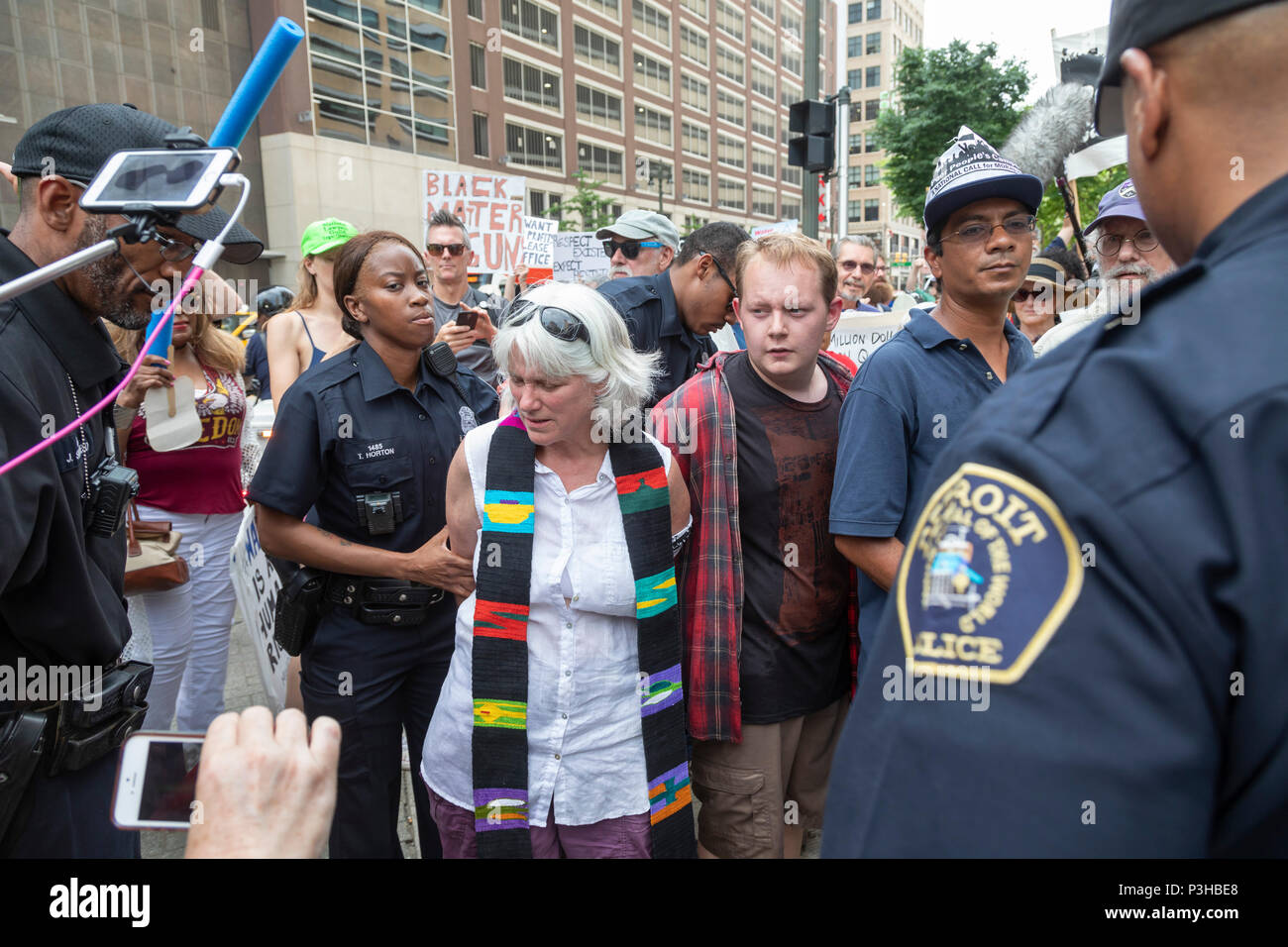 Detroit, Michigan USA - 18 June 2018 - Several hundred people rallied in Detroit to support the Poor Peoples Campaign against poverty, racism, militarism, and ecological devastation. Rev. Denise Griebler, pastor of First United Church of Christ in Richmond, Michigan, was among two dozen arrested for blocking the QLine streetcar to highlight the need for better public transportation in Detroit. Credit: Jim West/Alamy Live News Stock Photo
