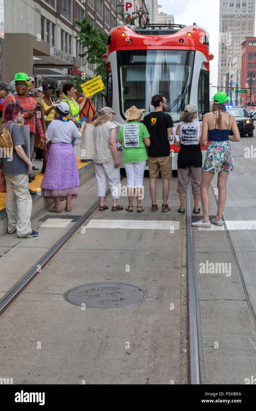 Detroit, Michigan USA - 18 June 2018 - Several hundred people rallied in Detroit to support the Poor Peoples Campaign against poverty, racism, militarism, and ecological devastation. Two dozen were arrested for blocking the QLine streetcar to highlight the need for better public transportation in Detroit. Credit: Jim West/Alamy Live News Stock Photo