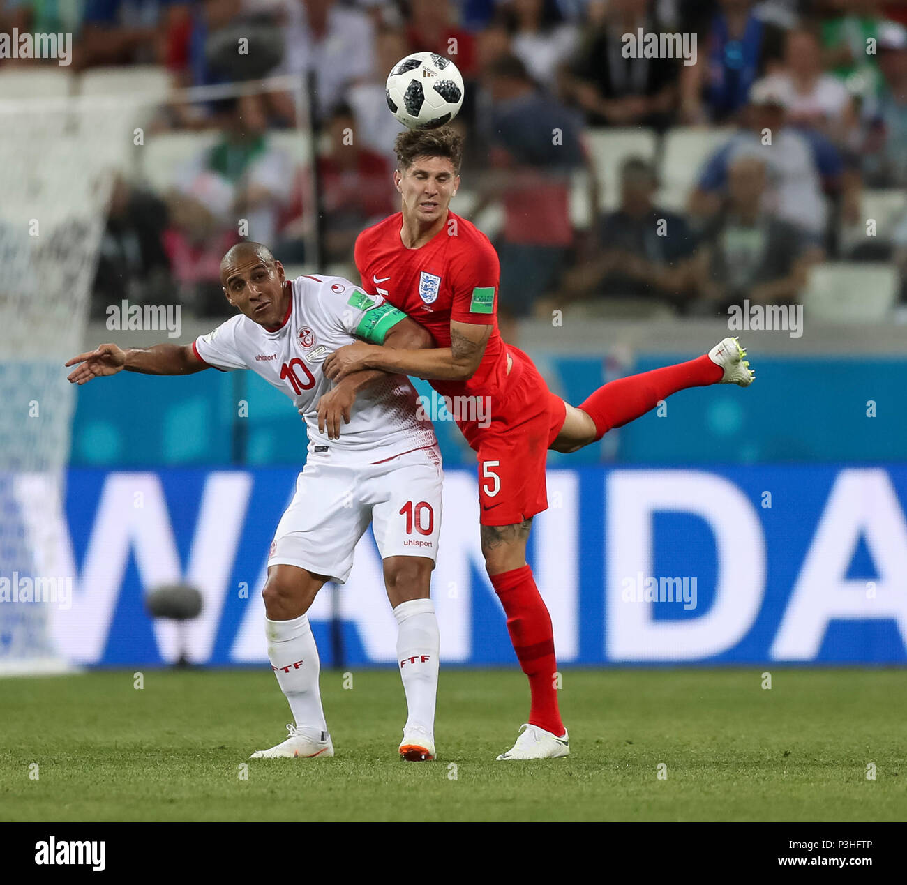 Volgograd, Russia. 18th June, 2018. Wahbi Khazri of Tunisia and John Stones of England during the 2018 FIFA World Cup Group G match between Tunisia and England at Volgograd Arena on June 18th 2018 in Volgograd, Russia.Credit: PHC Images/Alamy Live News Stock Photo