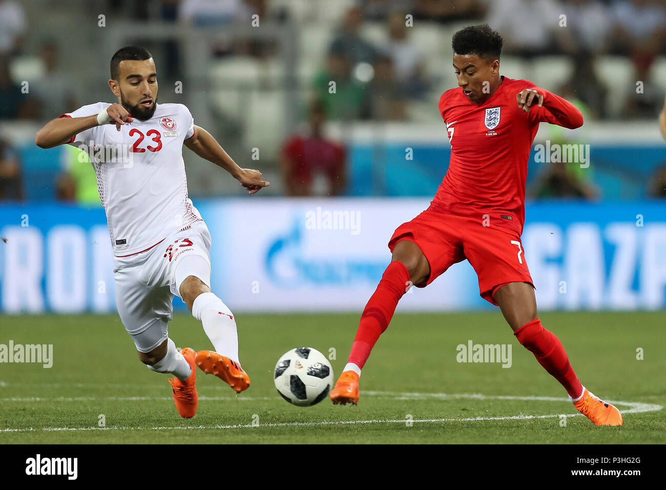 Volgograd, Russia. 18th June, 2018. Jesse Lingard of England and Naim Sliti of Tunisia during the 2018 FIFA World Cup Group G match between Tunisia and England at Volgograd Arena on June 18th 2018 in Volgograd, Russia.  Credit: PHC Images/Alamy Live News Stock Photo