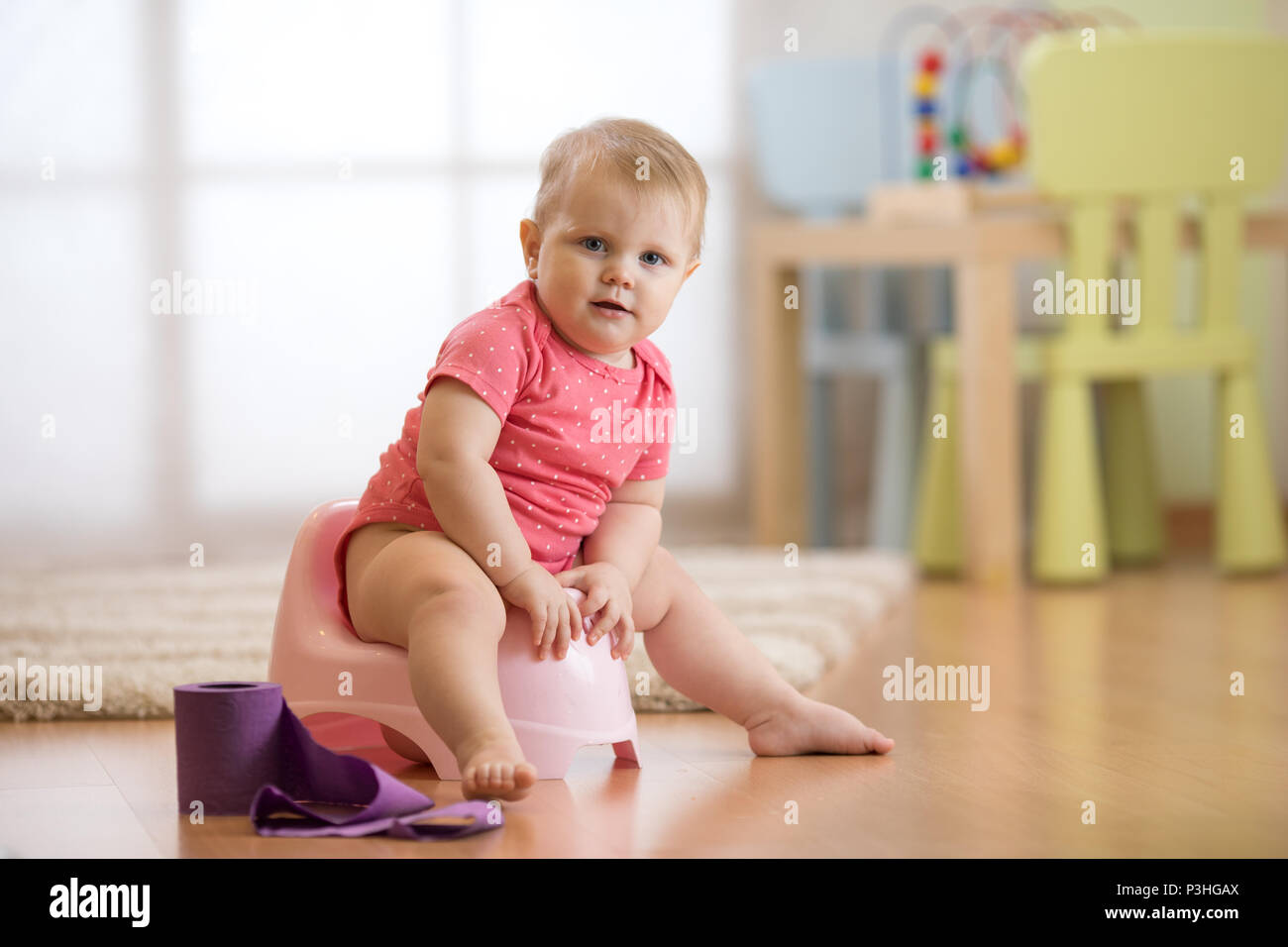 Child sitting on toilet potty hi-res stock photography and images - Alamy