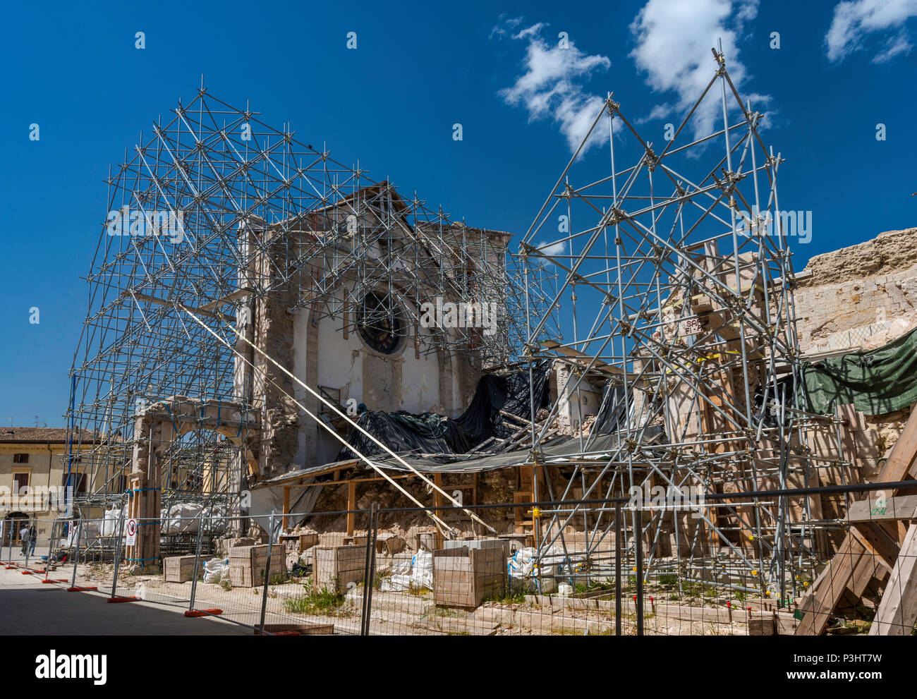 Facade, supported by scaffolding, of Basilica of San Benedetto, destroyed by earthquakes in October 2016, April 2018 view, in Norcia, Umbria, Italy Stock Photo