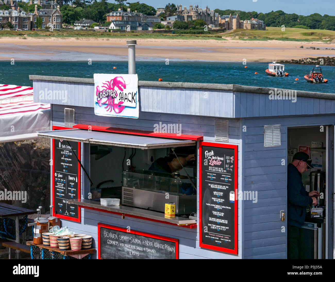 Lobster Shack takeaway food outlet in North Berwick harbour with beach in background, North Berwick, East Lothian, Scotland, UK Stock Photo