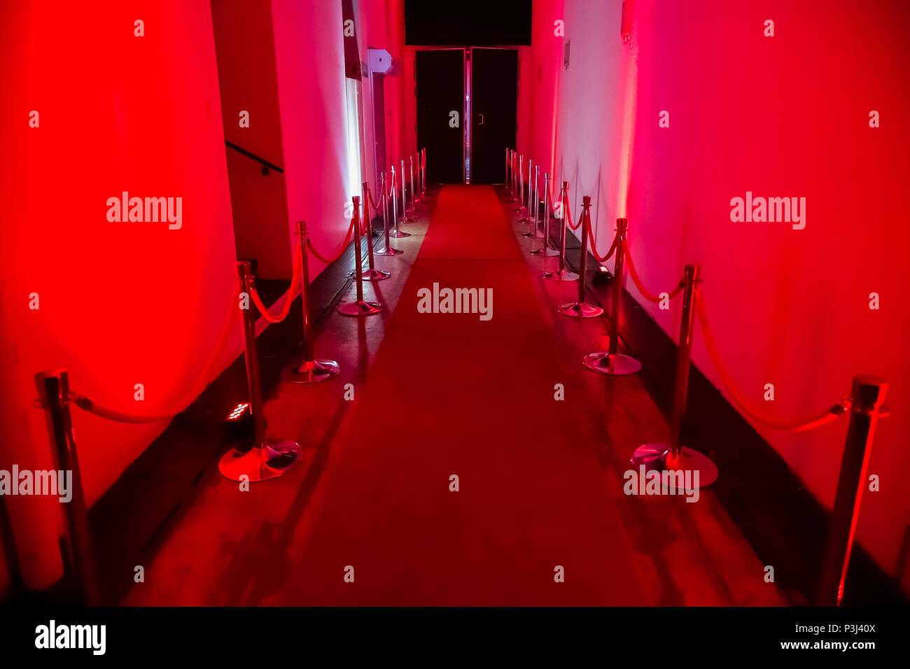 Interior passageway for night club or venue with red light theme Stock