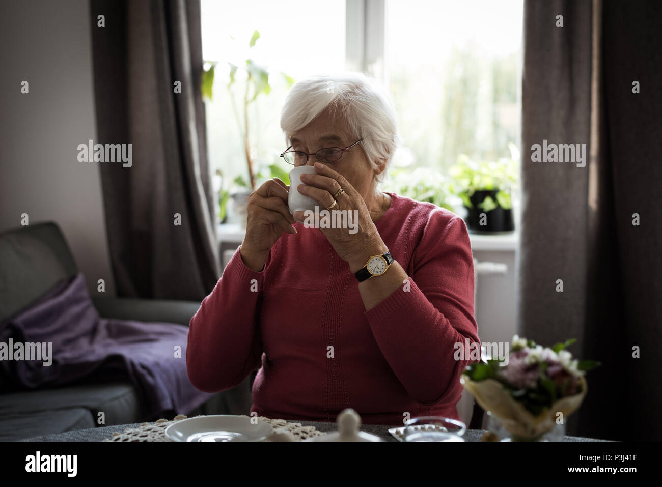Senior woman having cup of tea Stock Photo