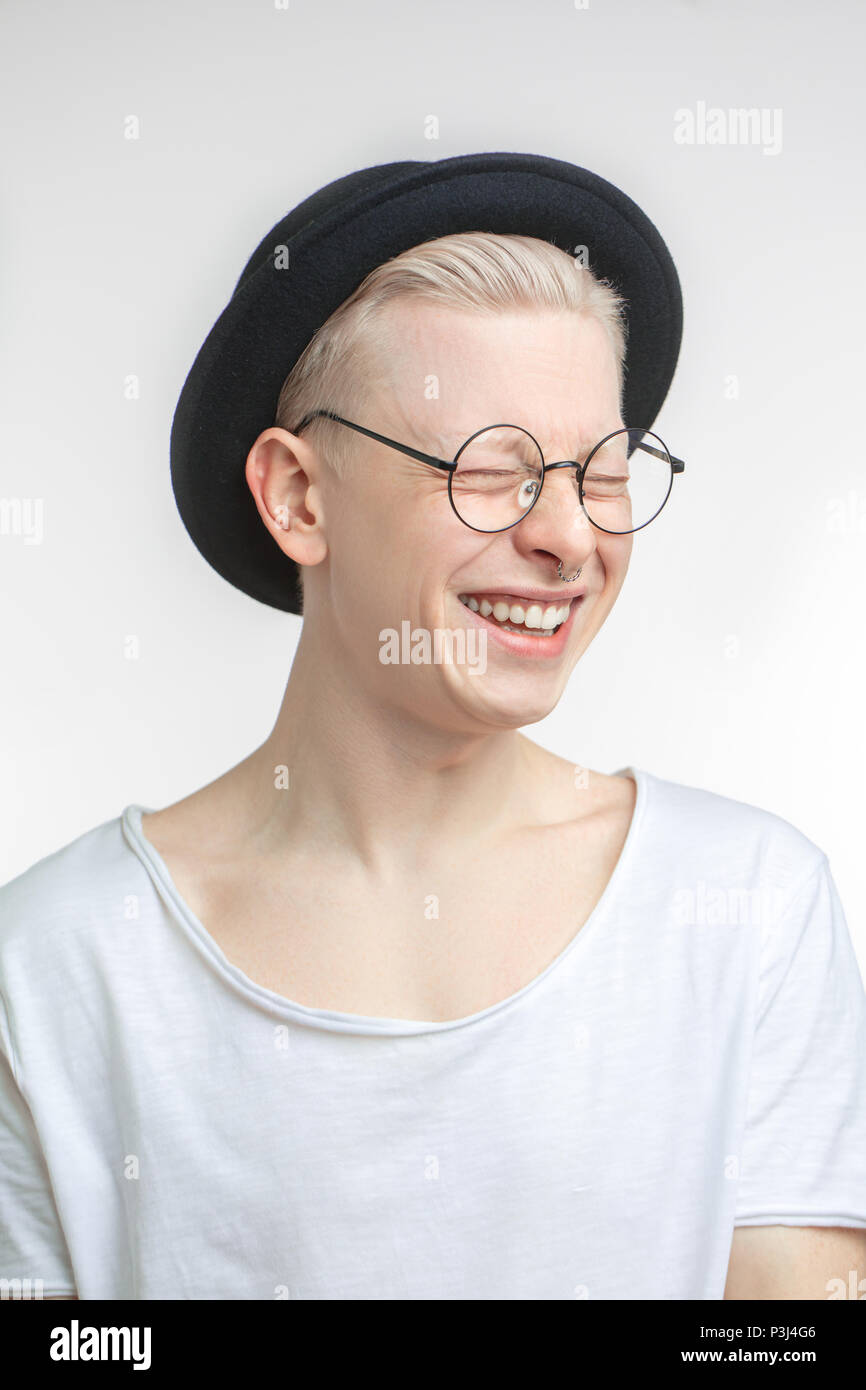 Portrait of a handsome young man, over a gray background Stock Photo ...
