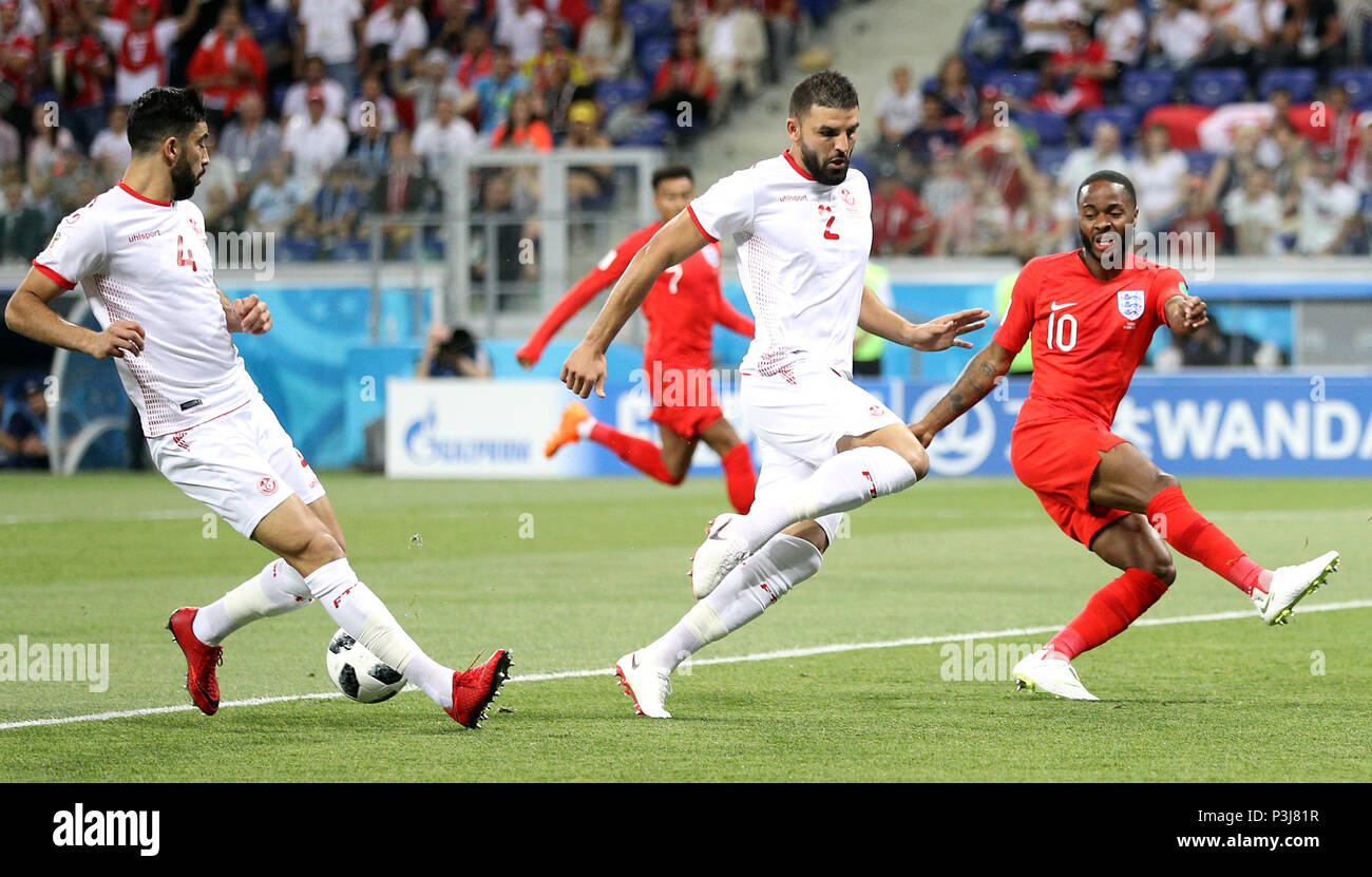Tunisia's Yassine Meriah (left), Syam Ben Youssef and England's Raheem Sterling (right) in action during the FIFA World Cup Group G match at The Volgograd Arena, Volgograd. Stock Photo