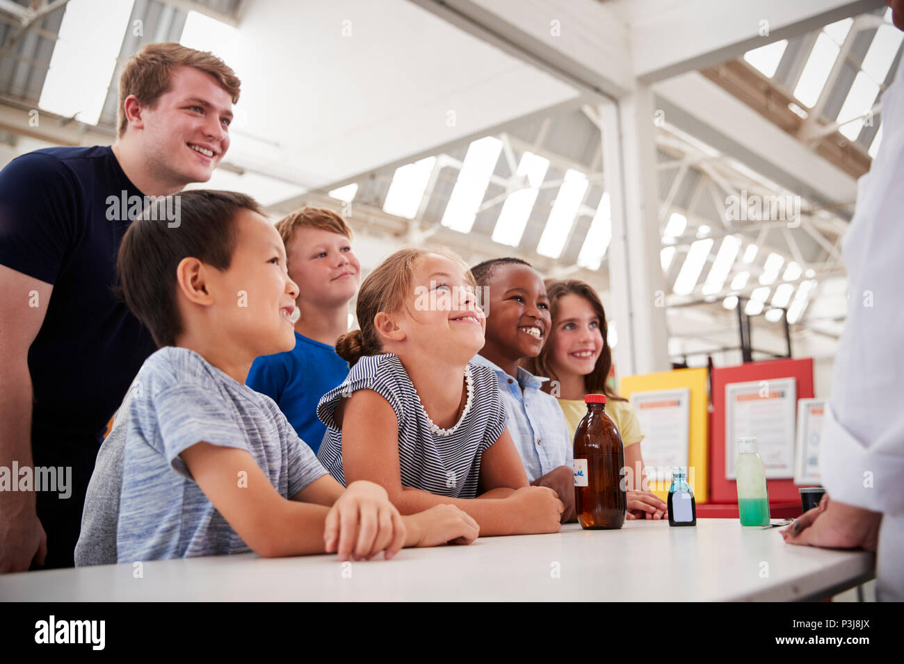 Group of kids with teachers having fun at a science centre Stock Photo