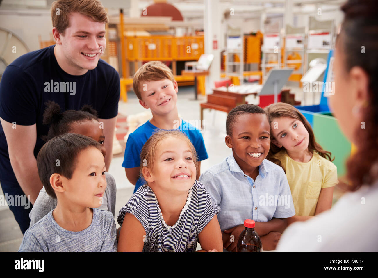 Teacher and kids having fun at a science centre Stock Photo