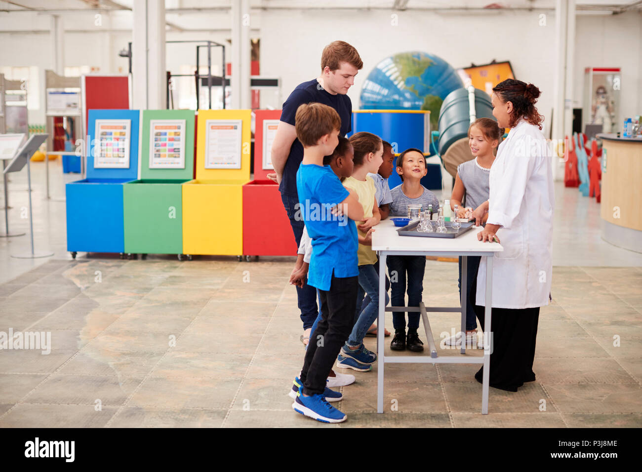 school kids watching a presentation at a science centre stock photo kids presentation