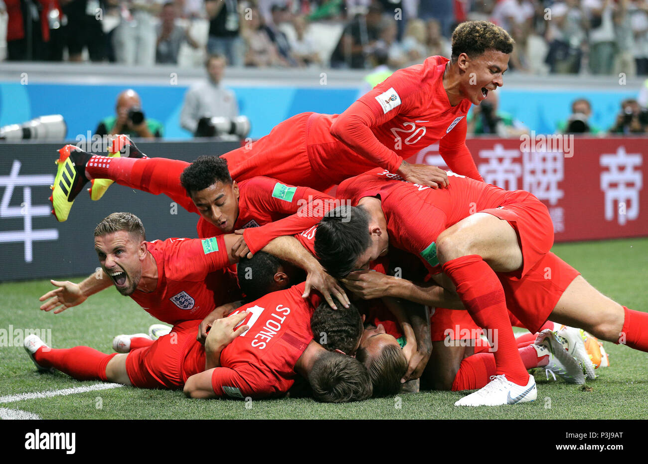 England S Harry Kane Hidden Is Mobbed By Team Mates As He Scores His Side S First Goal Of The Game During The Fifa World Cup Group G Match At The Volgograd Arena Volgograd Stock