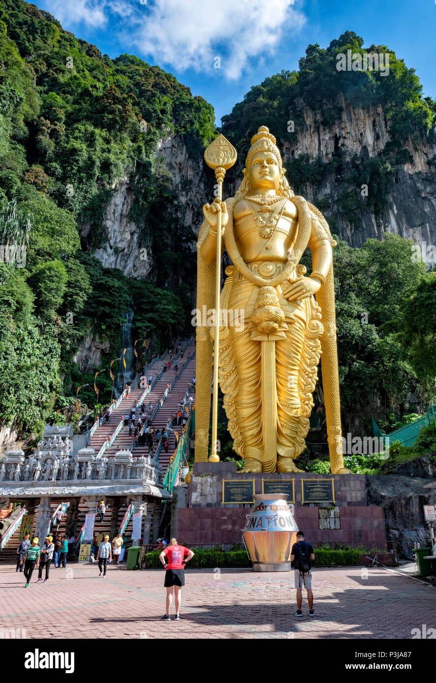 The Golden Statue outside the Hindu Temple in the Batu Caves at Selangor, on Borneo, Malaysia Stock Photo