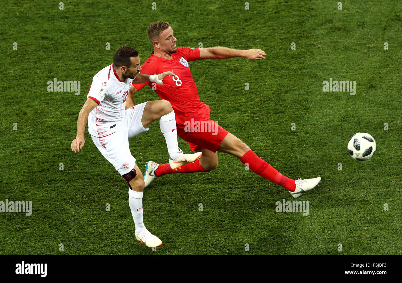 Tunisia's Ali Maaloul (left) and England's Jordan Henderson battle for the ball during the FIFA World Cup Group G match at The Volgograd Arena, Volgograd. Stock Photo