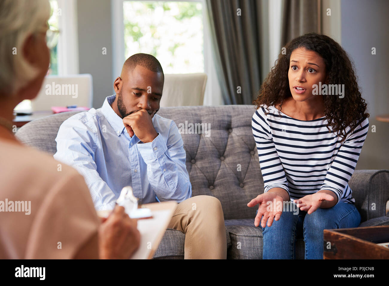 Young couple having marriage counselling Stock Photo