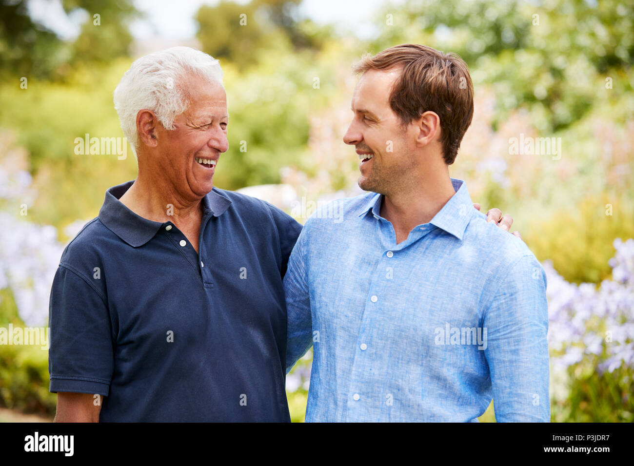 Father son park walk hi-res stock photography and images - Alamy