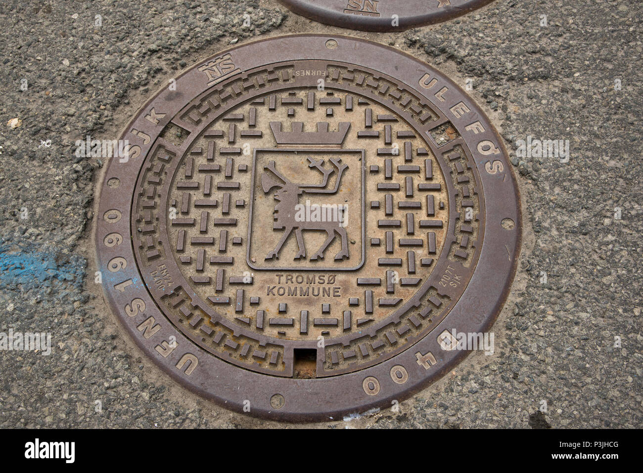 A reindeer is the coat of arms of Tromsø and therefore of the largest urban area in Northern Norway.It is shown also on manhole covers. Stock Photo