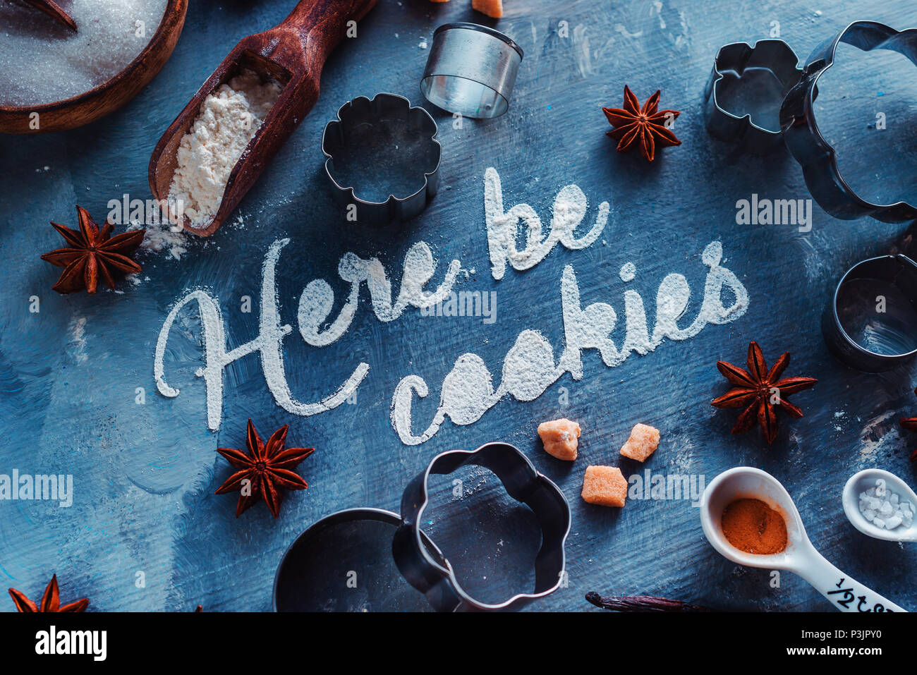 Food typography concept with cooking utensils and ingredients. Here be Cookies text close-up on a stone kitchen table Stock Photo